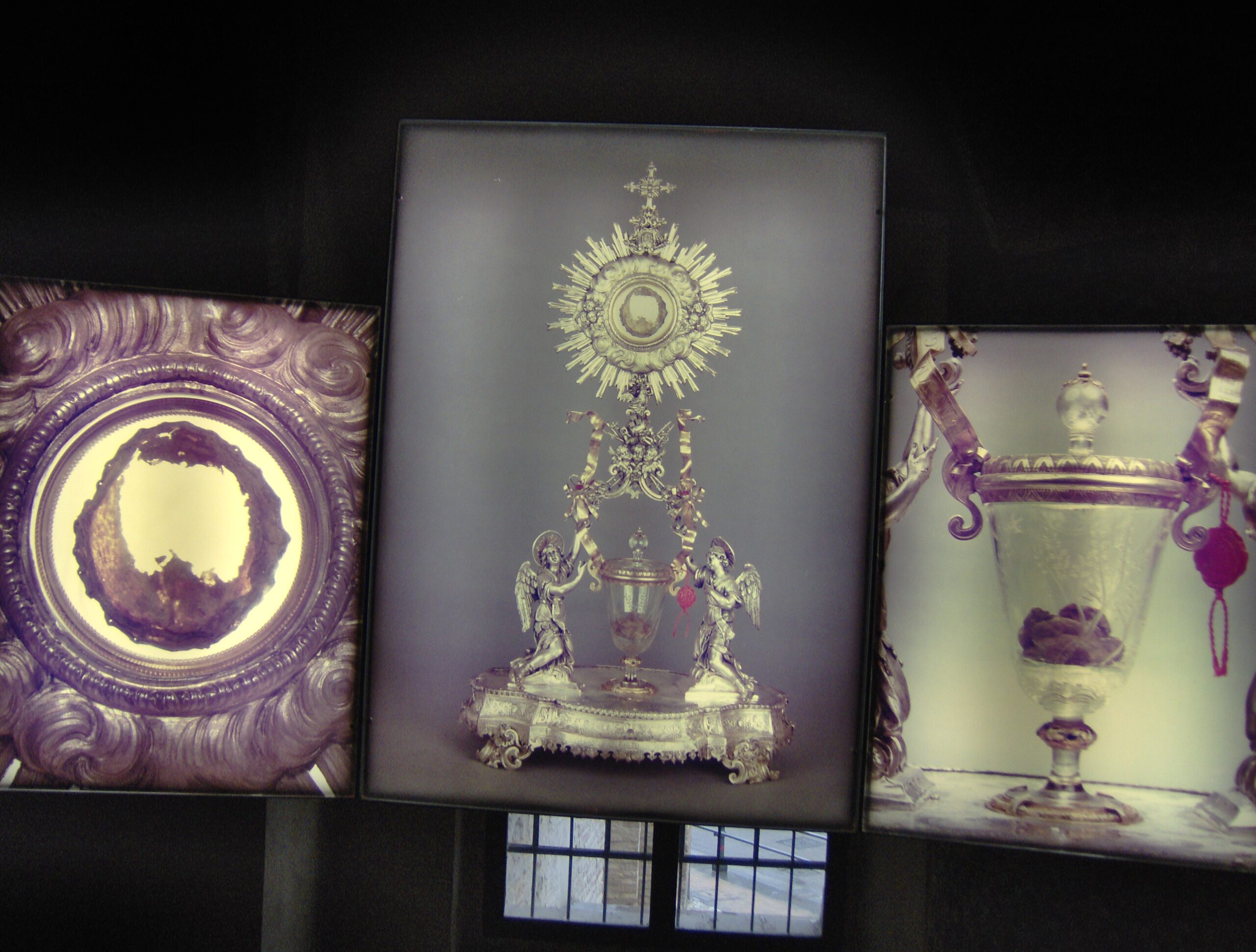 Rear-lighted display panel of the Eucharistic Miracle of Lanciano showing the preserved flesh and coagulated blood globules